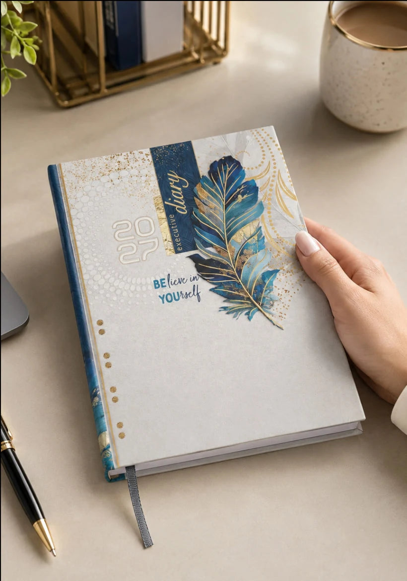 2027 cream, blue and gold paper pasting executive diary V-340 with decorative feather cover design, blue spine, and ribbon bookmark.

